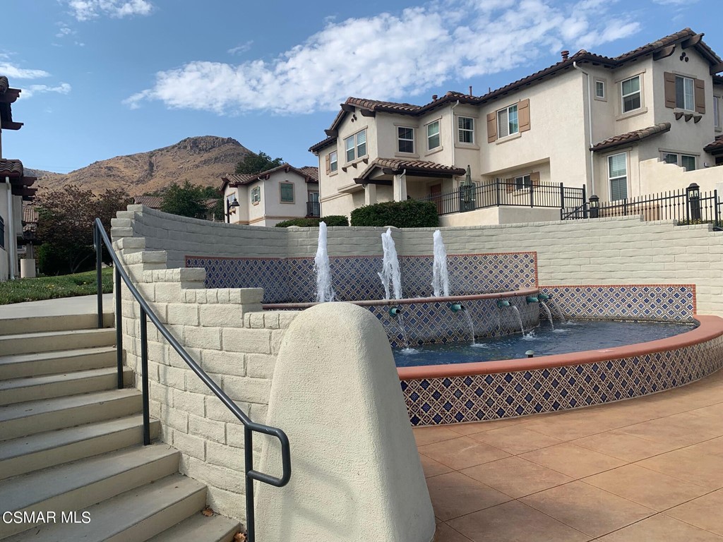 108 Via Katrina Newbury Park, CA 91320 - Photo 9 of 13 a view of a white building with a fountain in front of it