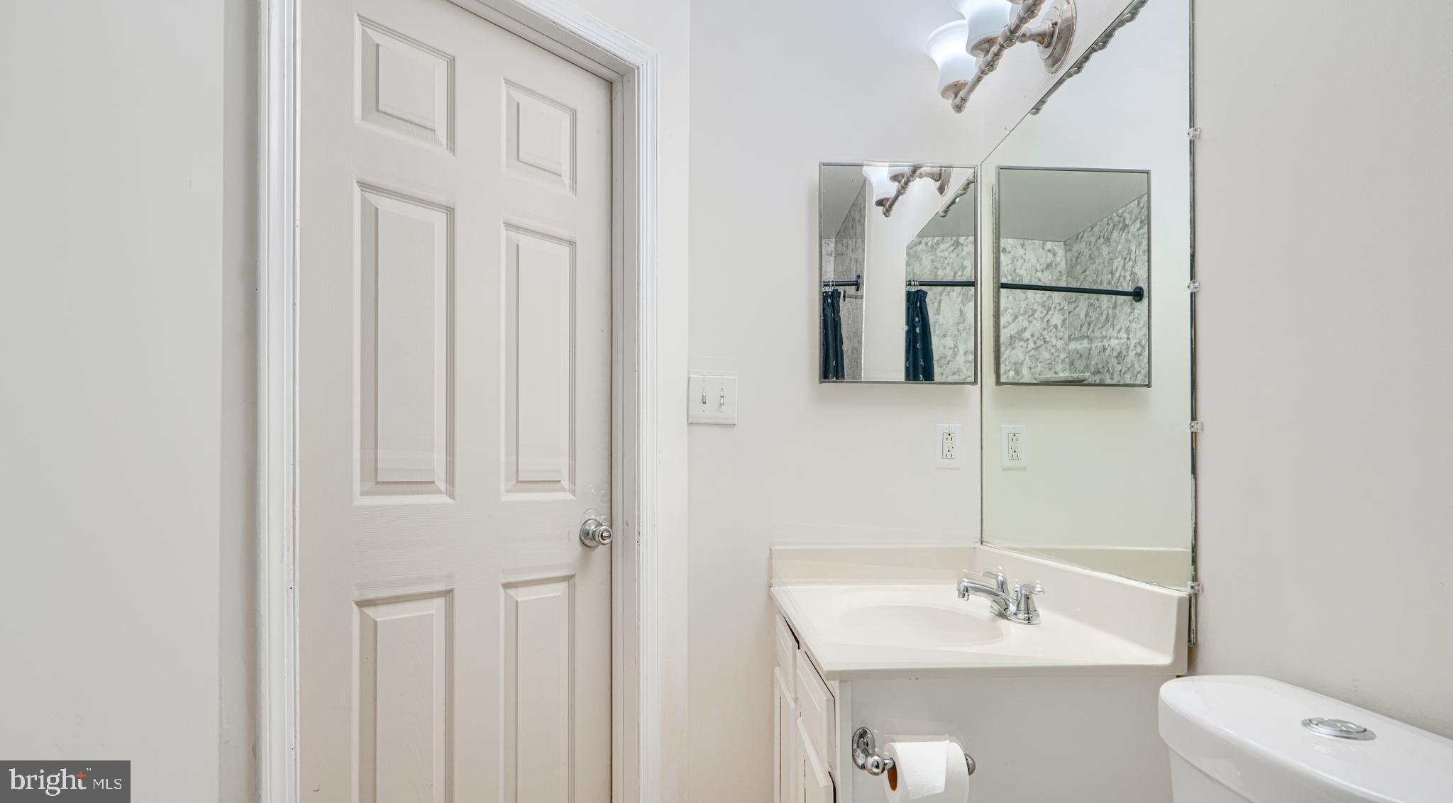 8664 Castlemill Circle Nottingham, MD 21236 - Photo 29 of 41 a bathroom with a sink a toilet and shower