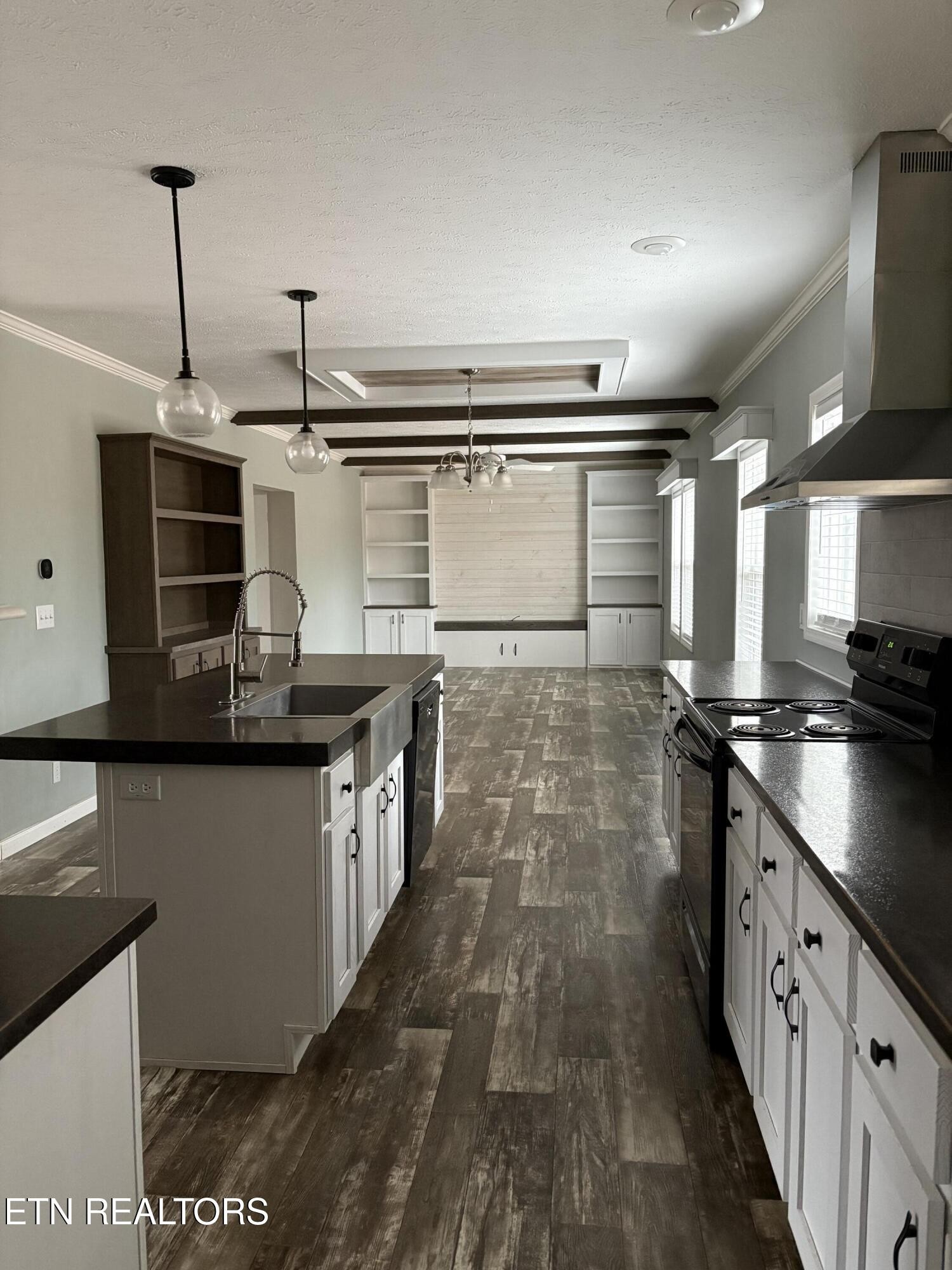 136 Hillview Road Ten Mile, TN 37880 - Photo 11 of 34 a kitchen with stainless steel appliances granite countertop a sink a stove and a wooden floors