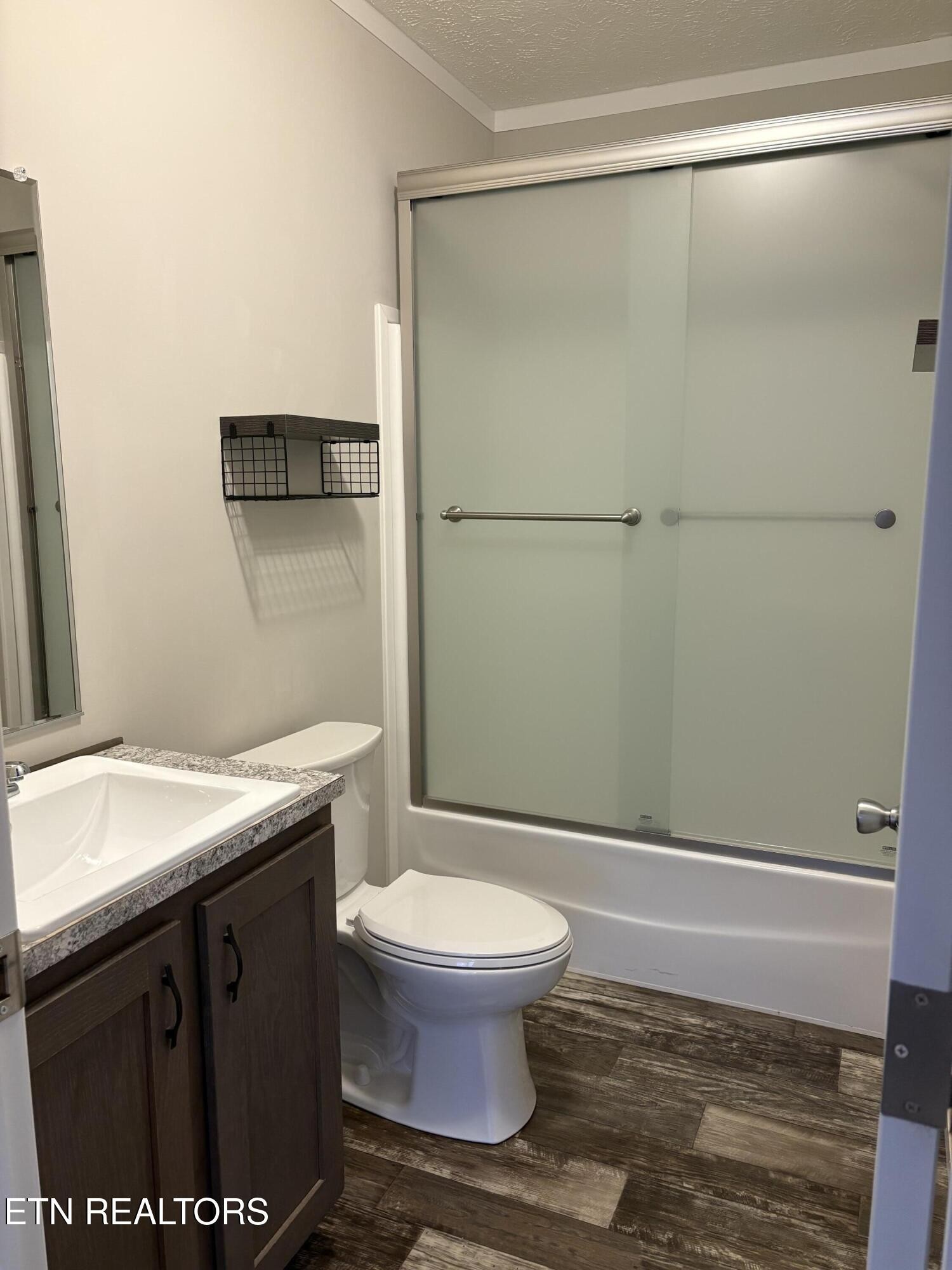 136 Hillview Road Ten Mile, TN 37880 - Photo 14 of 34 a bathroom with a granite countertop sink toilet and a mirror