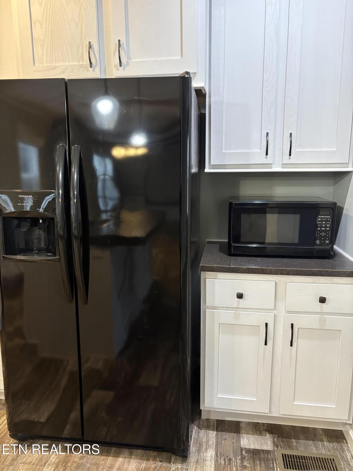 136 Hillview Road Ten Mile, TN 37880 - Photo 29 of 34 a kitchen with granite countertop white cabinets and stainless steel appliances