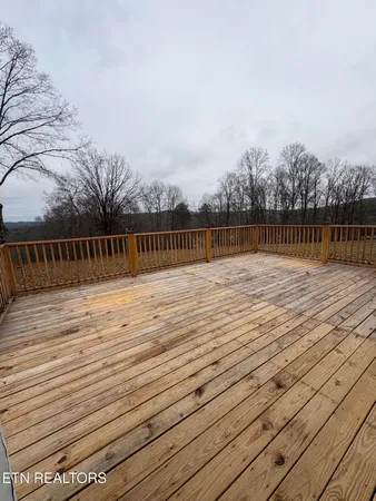 a view of swimming pool with outdoor seating and yard in the back