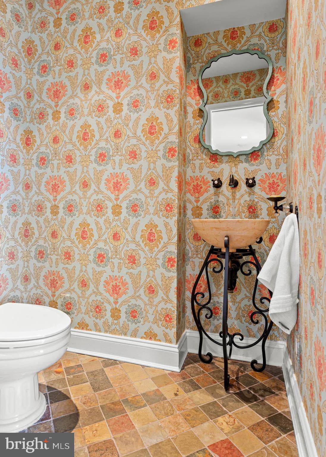 240 Church Road Devon, PA 19333 - Photo 24 of 75 a bathroom with a toilet and a mirror
