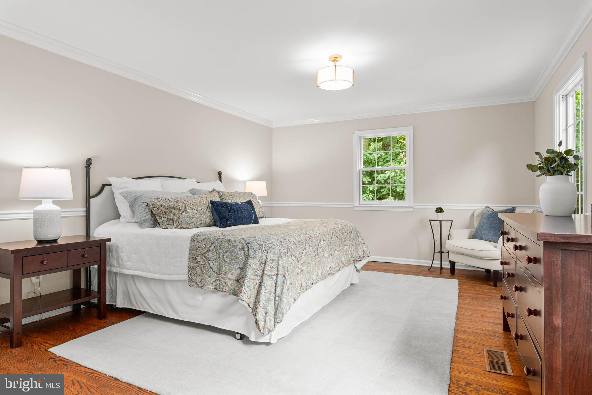 240 Church Road Devon, PA 19333 - Photo 39 of 75 a spacious bedroom with a bed and window