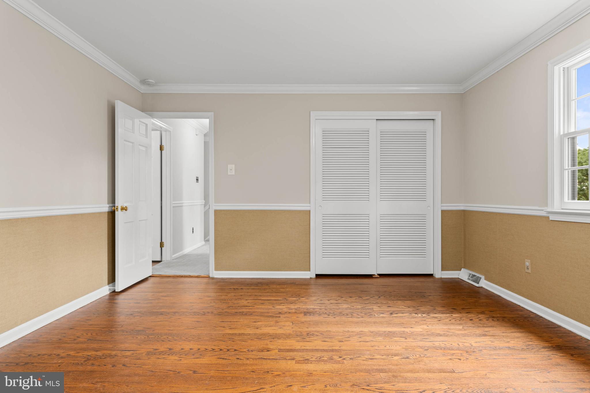 240 Church Road Devon, PA 19333 - Photo 49 of 75 an empty room with wooden floor and white walls