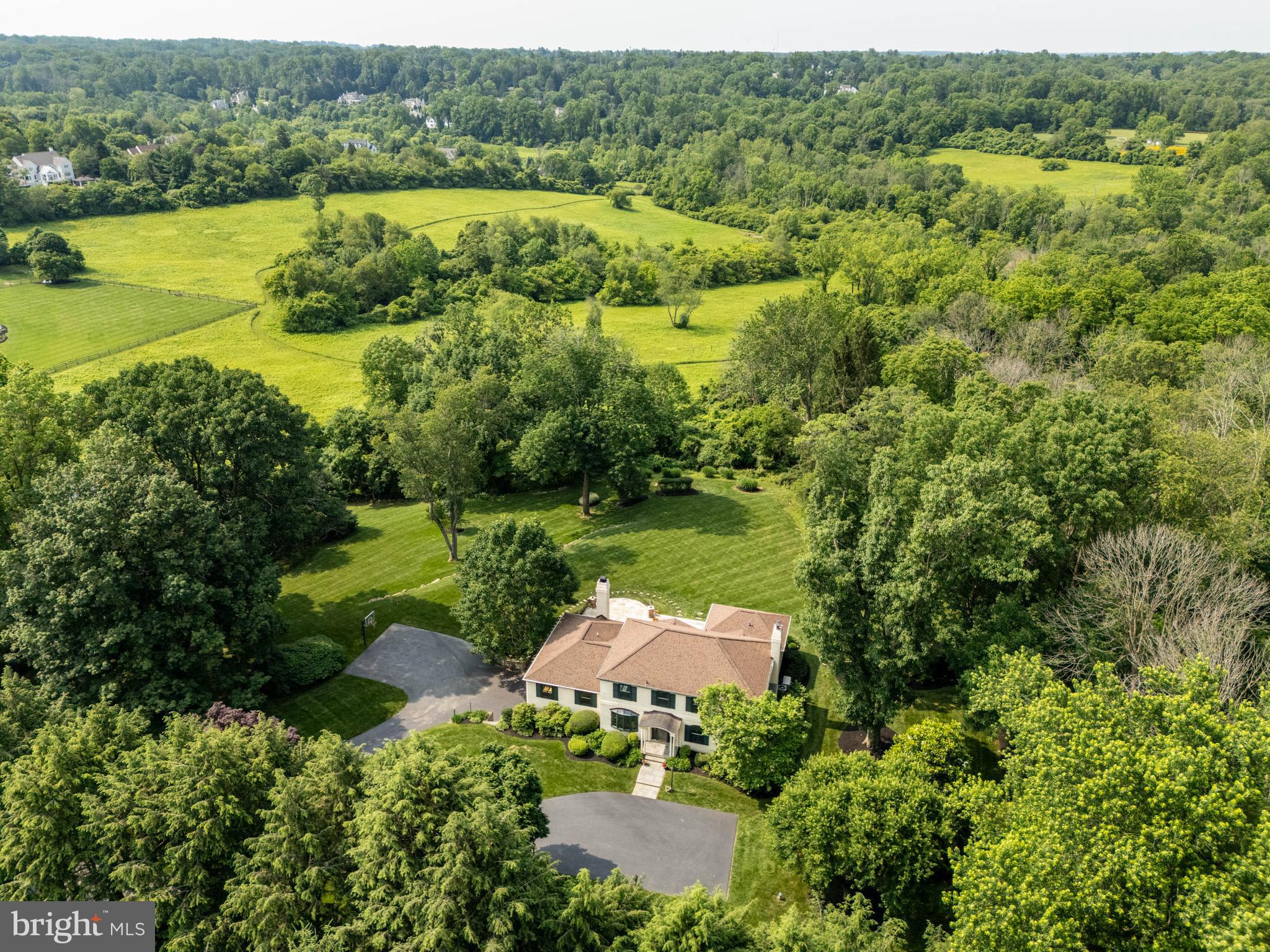 240 Church Road Devon, PA 19333 - Photo 72 of 75 an aerial view of a houses with outdoor space and a lake view