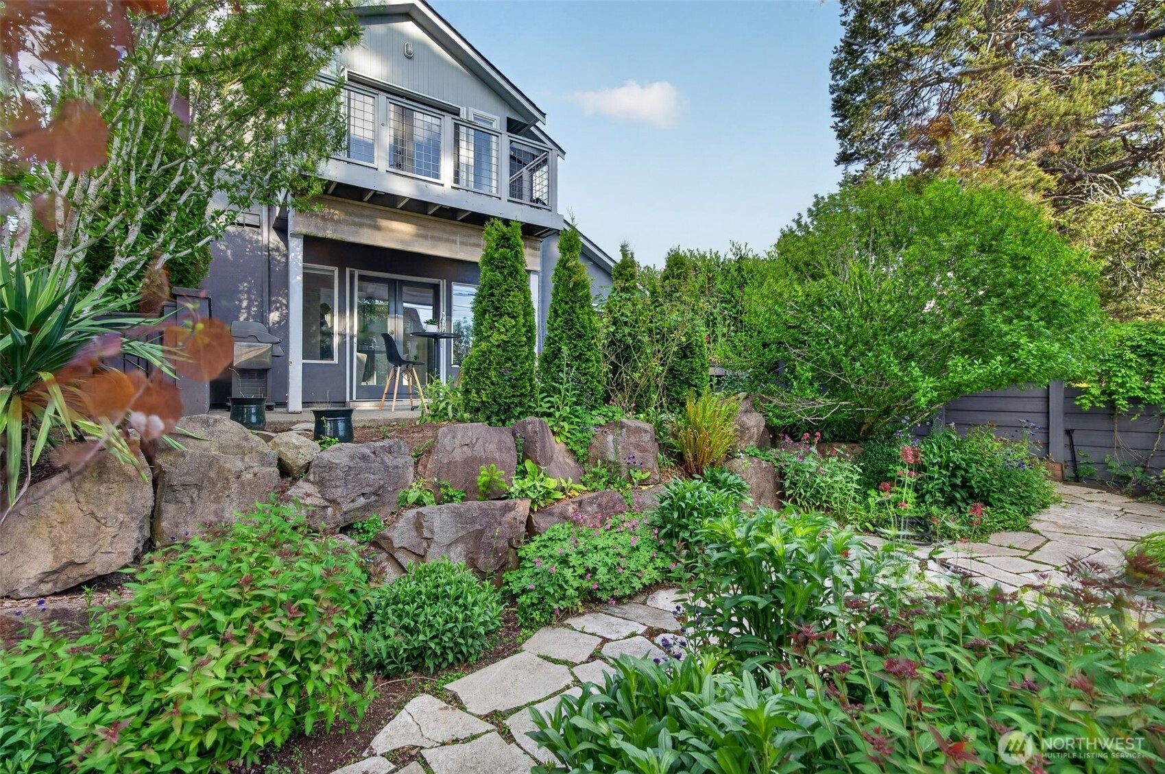 7700 California Avenue Southwest Seattle, WA 98136 - Photo 1 of 40 a backyard of a house with lots of green space