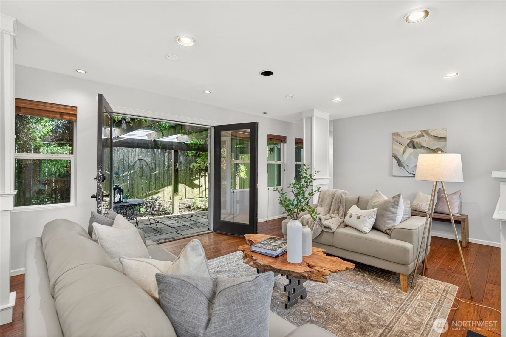 7700 California Avenue Southwest Seattle, WA 98136 - Photo 15 of 40 a living room with furniture and a large window