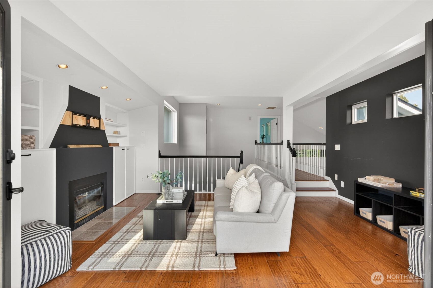 7700 California Avenue Southwest Seattle, WA 98136 - Photo 20 of 40 a living room with furniture and a fireplace