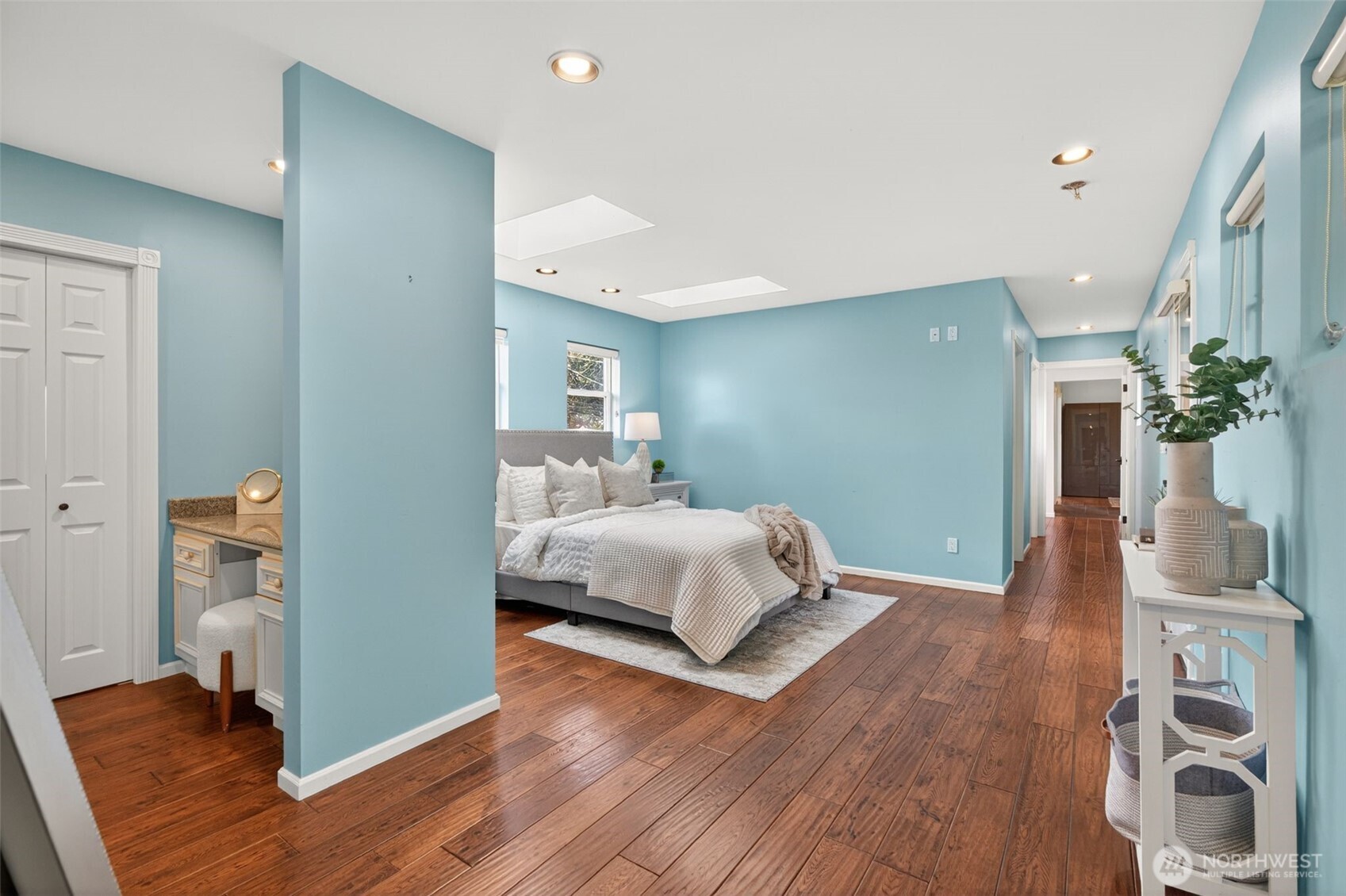 7700 California Avenue Southwest Seattle, WA 98136 - Photo 22 of 40 a bedroom with a bed and wooden floor