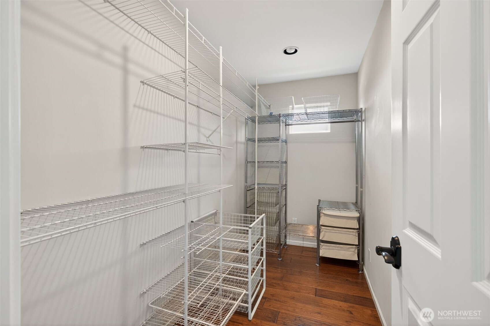 7700 California Avenue Southwest Seattle, WA 98136 - Photo 26 of 40 a view of walk in closet with empty racks