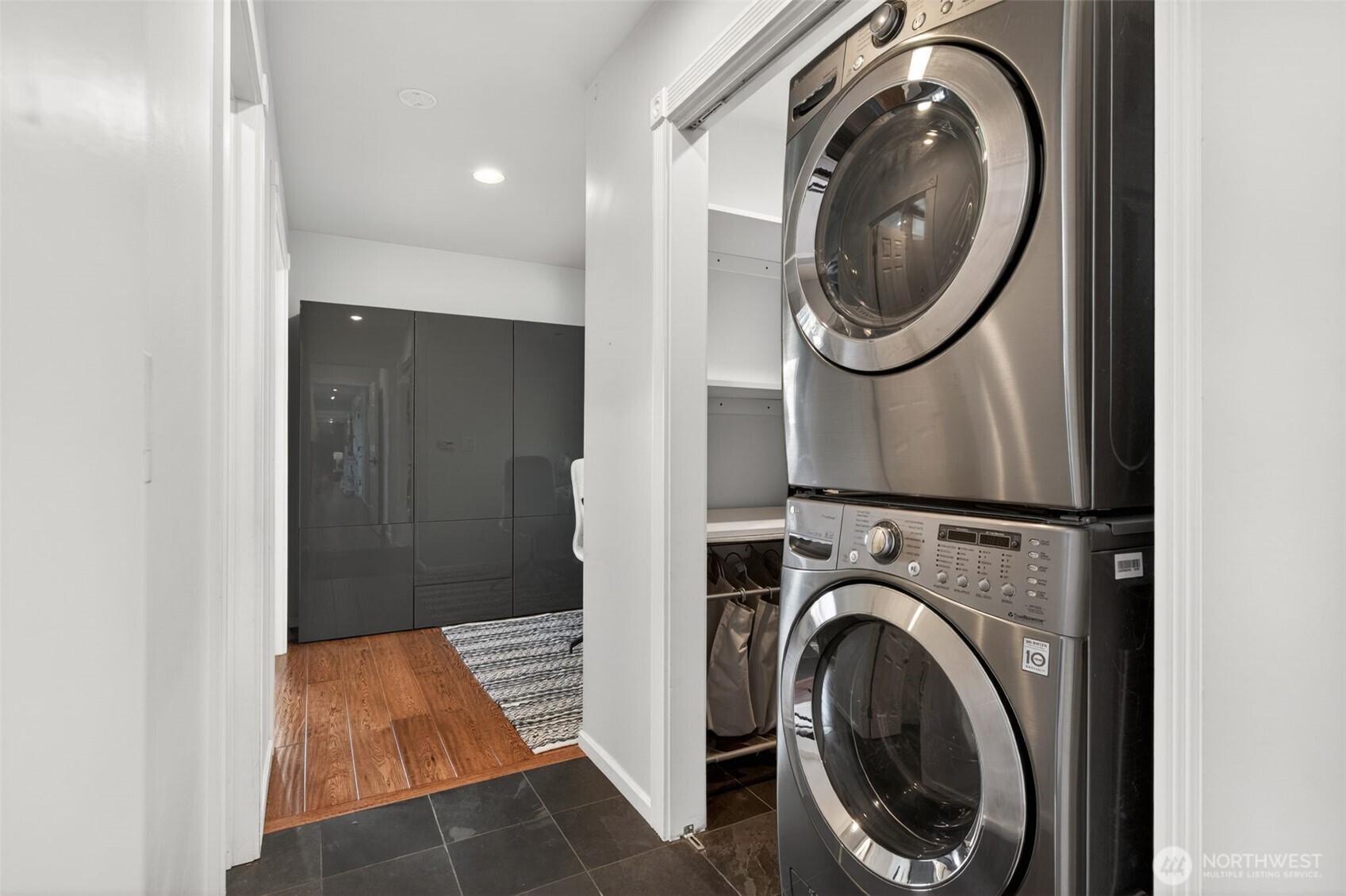 7700 California Avenue Southwest Seattle, WA 98136 - Photo 27 of 40 a view of a hallway with washer and dryer