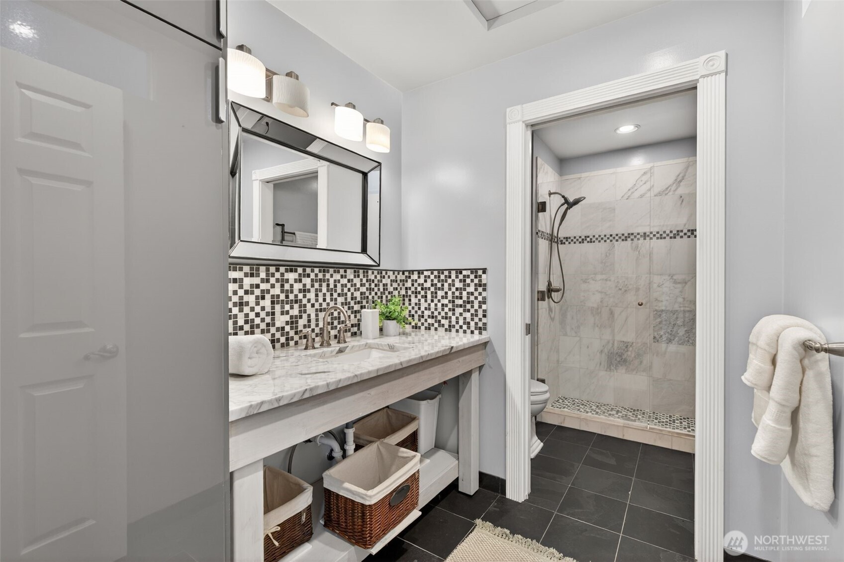 7700 California Avenue Southwest Seattle, WA 98136 - Photo 28 of 40 a bathroom with a sink a toilet and shower