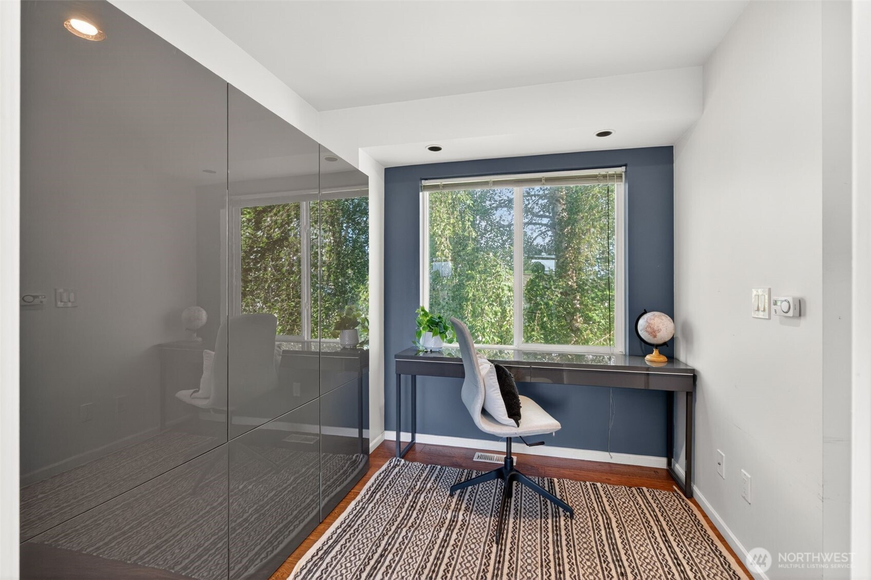 7700 California Avenue Southwest Seattle, WA 98136 - Photo 29 of 40 a view of a workspace with wooden floor and a window