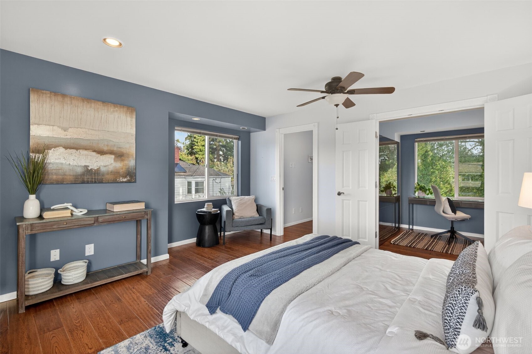 7700 California Avenue Southwest Seattle, WA 98136 - Photo 31 of 40 a bedroom with a bed and wooden floor