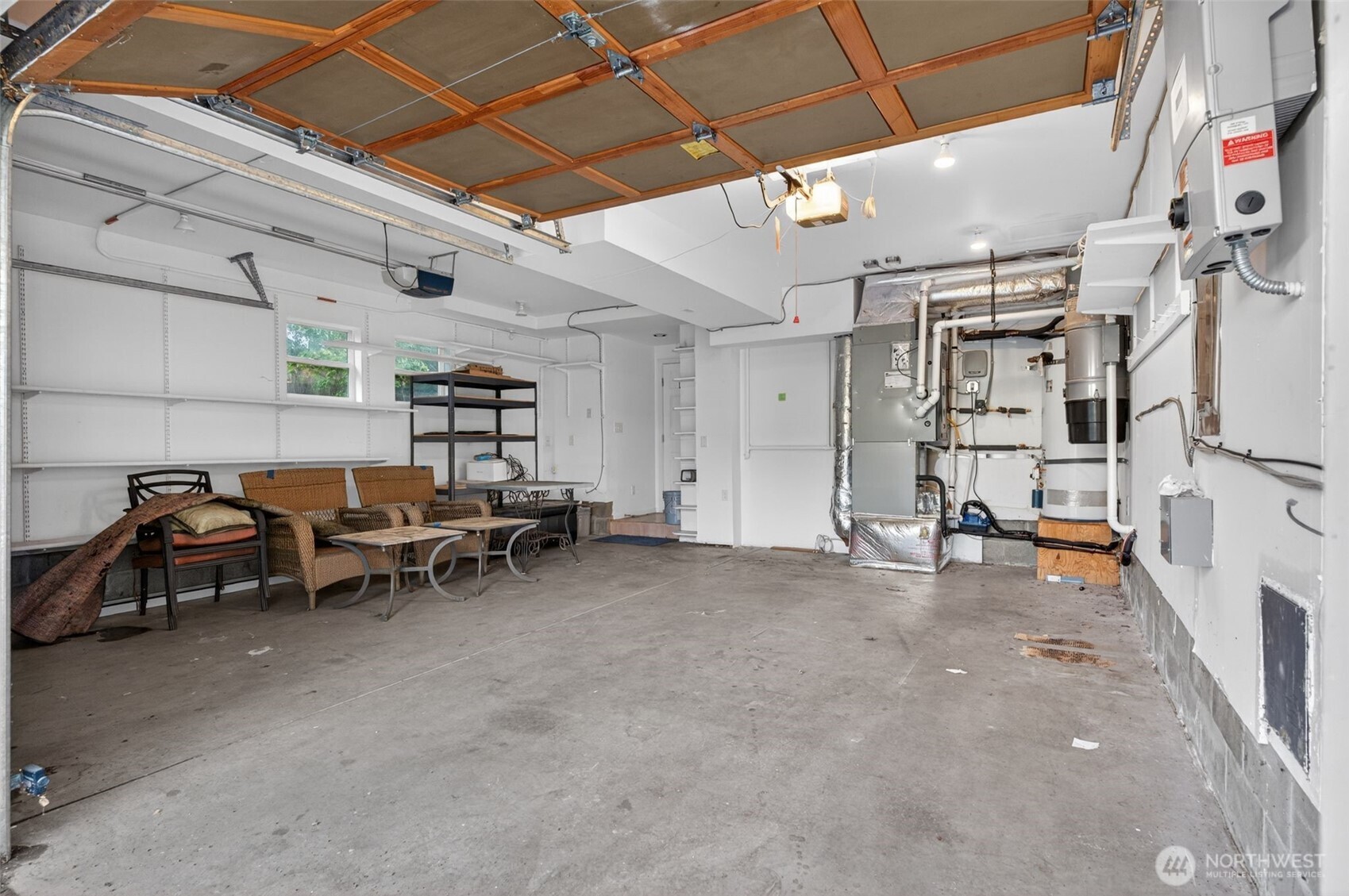 7700 California Avenue Southwest Seattle, WA 98136 - Photo 32 of 40 a view of a garage with furniture