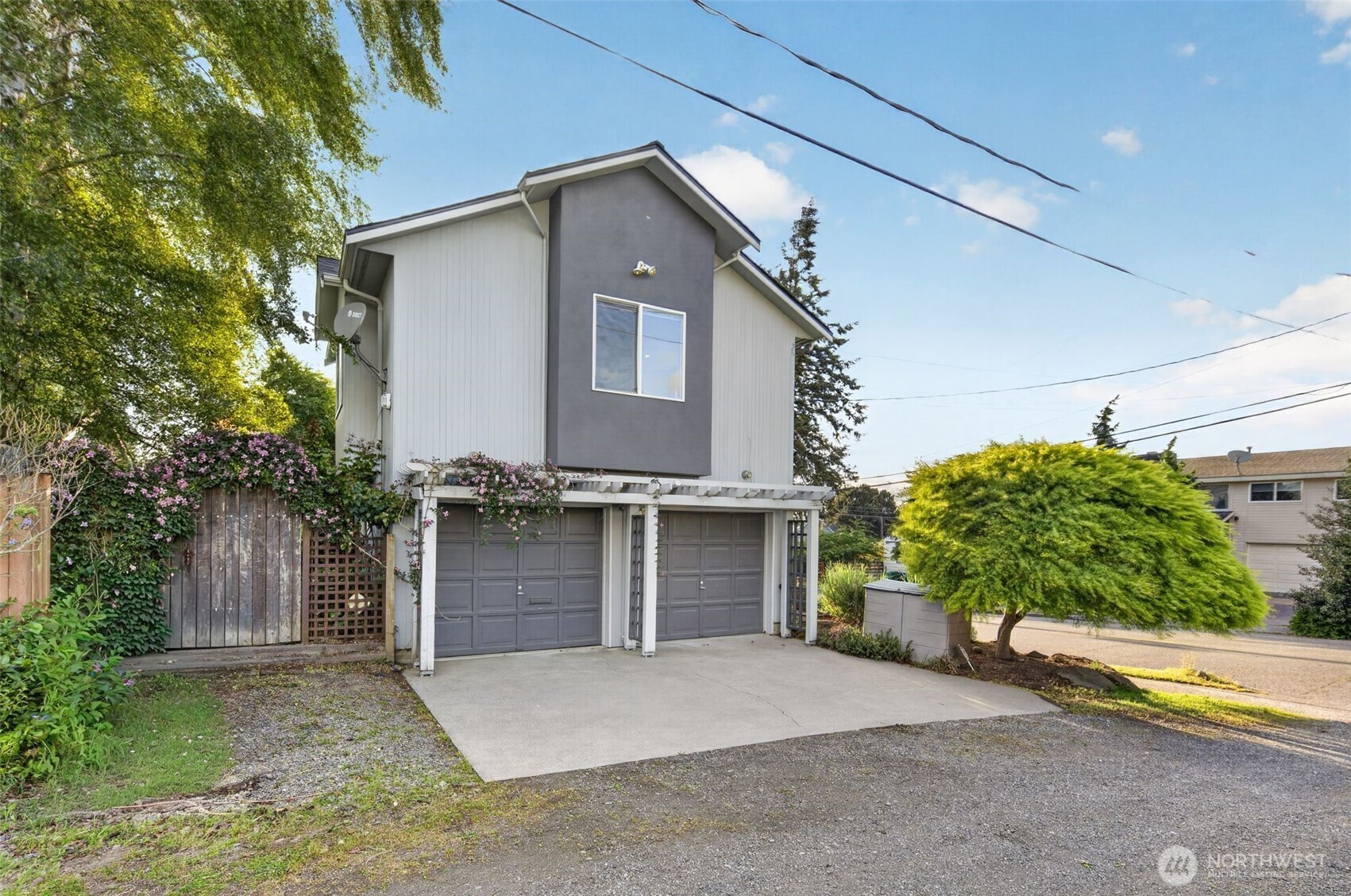 7700 California Avenue Southwest Seattle, WA 98136 - Photo 35 of 40 a front view of a house with a yard and garage