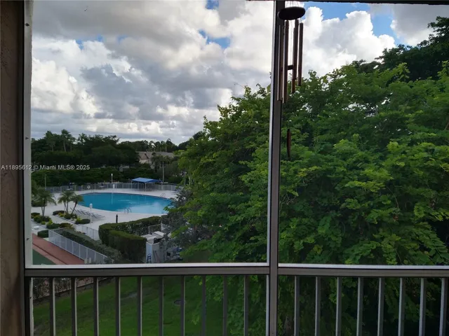 a view of a balcony with a garden