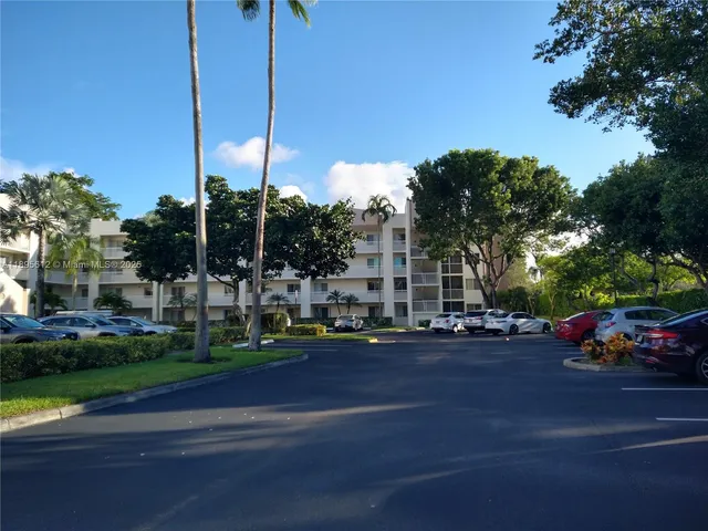 a view of a street with cars