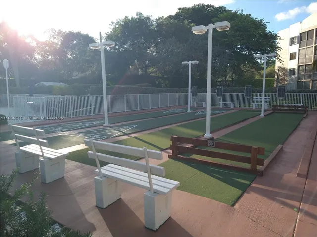 a view of backyard with trampoline