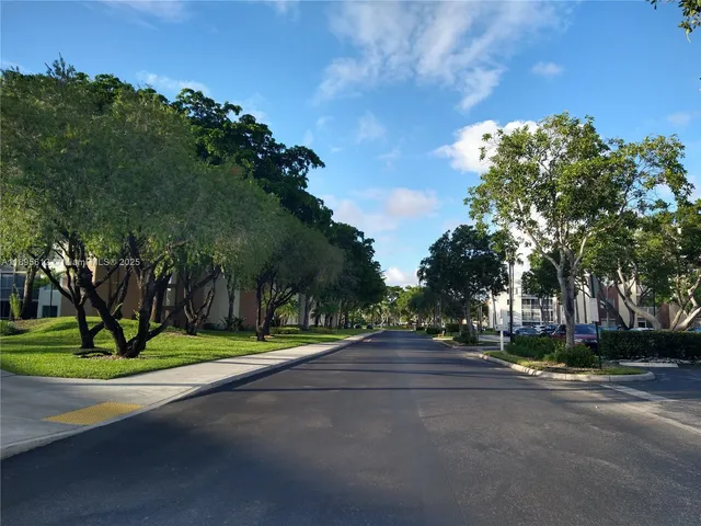 a view of street along with trees