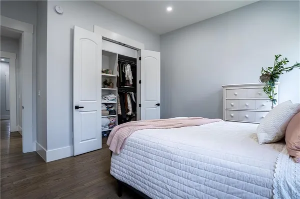 a view of walk in closet with clothes