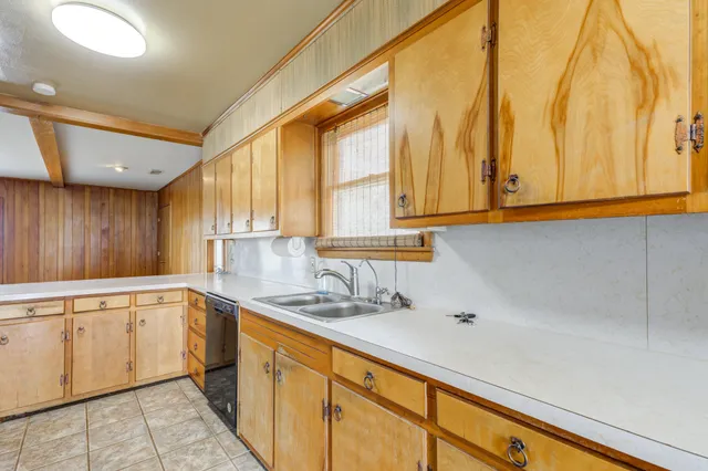 a kitchen with a stove and a refrigerator