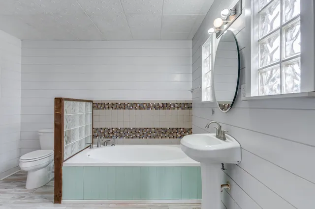 a bathroom with a bathtub and a shower