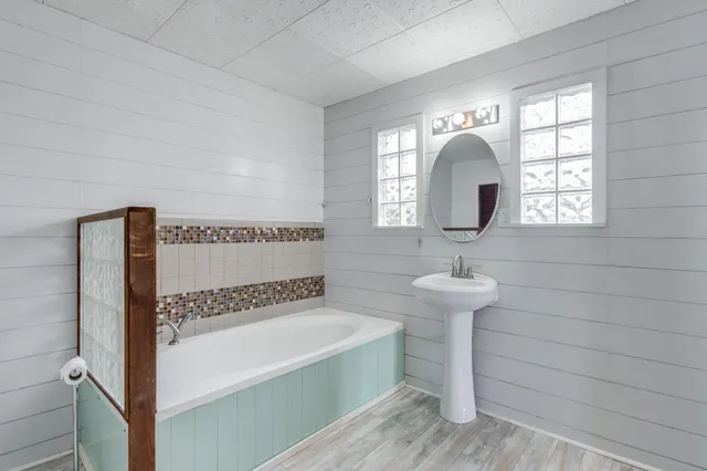 a bathroom with a sink and a mirror
