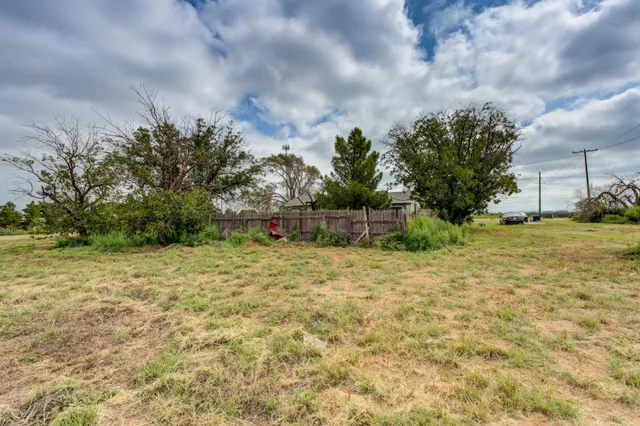 an aerial view of a house with a ocean view
