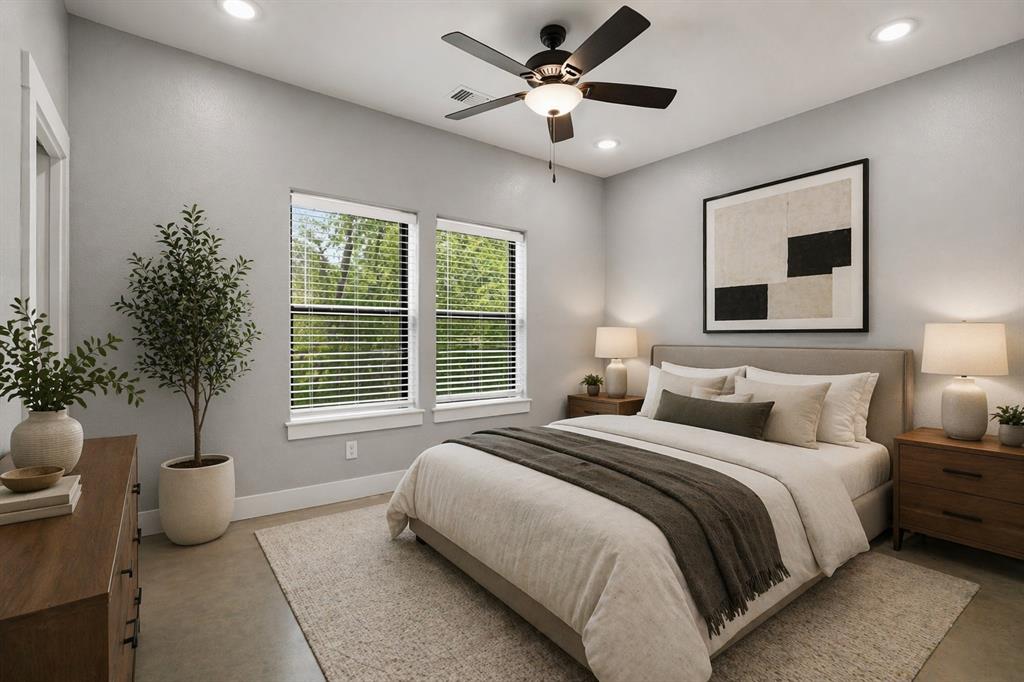 738 East Sears Street Denison, TX 75021 - Photo 16 of 32 a bedroom with a bed and a potted plant
