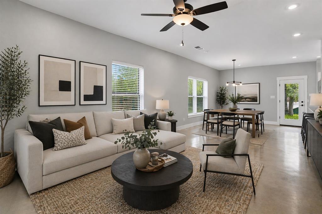 738 East Sears Street Denison, TX 75021 - Photo 2 of 32 a living room with furniture and a large window