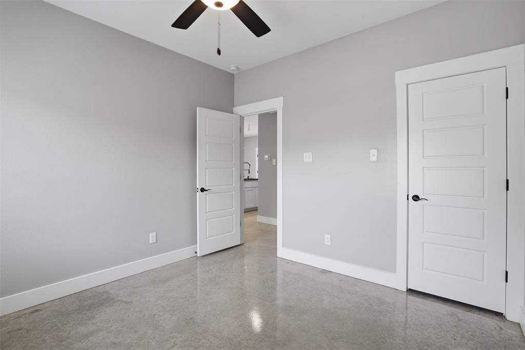 738 East Sears Street Denison, TX 75021 - Photo 24 of 32 an empty room with chandelier fan