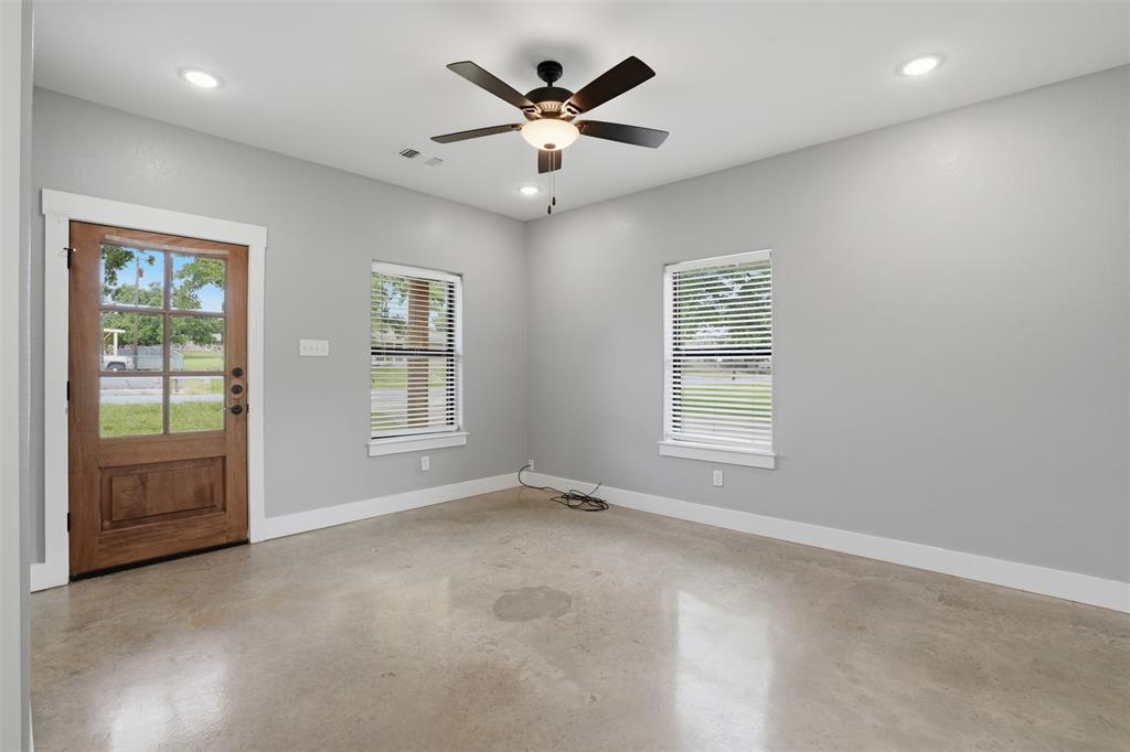738 East Sears Street Denison, TX 75021 - Photo 7 of 32 a view of an empty room with a window