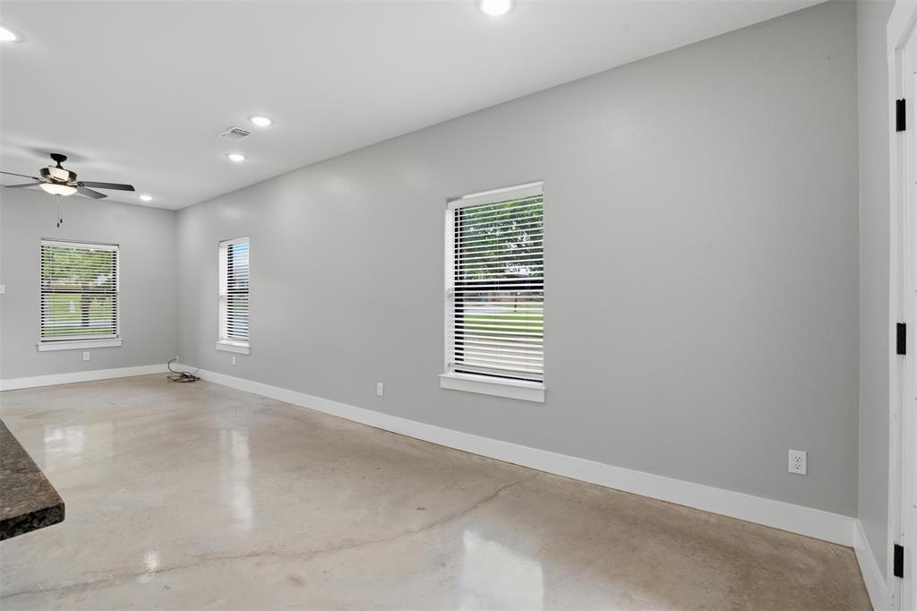 738 East Sears Street Denison, TX 75021 - Photo 9 of 32 an empty room with windows