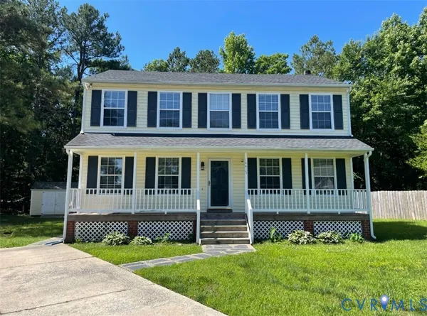front view of a house with a yard