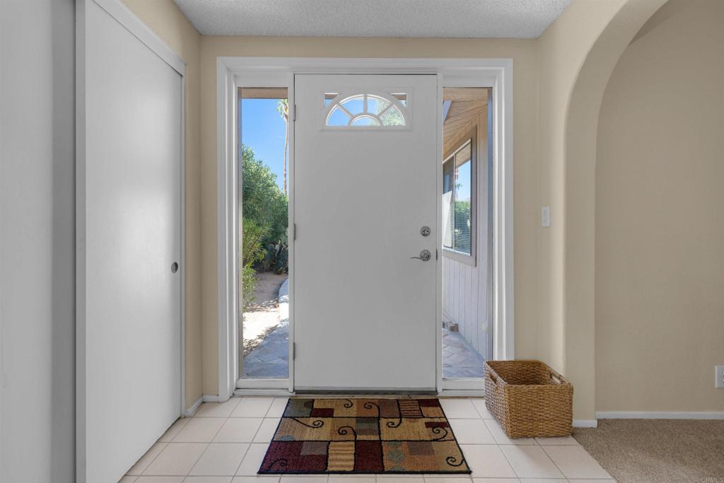 1010 Palm Canyon Drive, Unit 168 Borrego Springs, CA 92004 - Photo 12 of 34 a view of a hallway with wooden floor and a living room