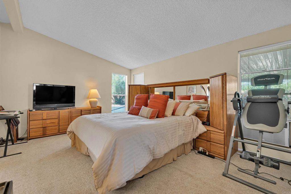 1010 Palm Canyon Drive, Unit 168 Borrego Springs, CA 92004 - Photo 16 of 34 a bedroom with a bed and a flat screen tv