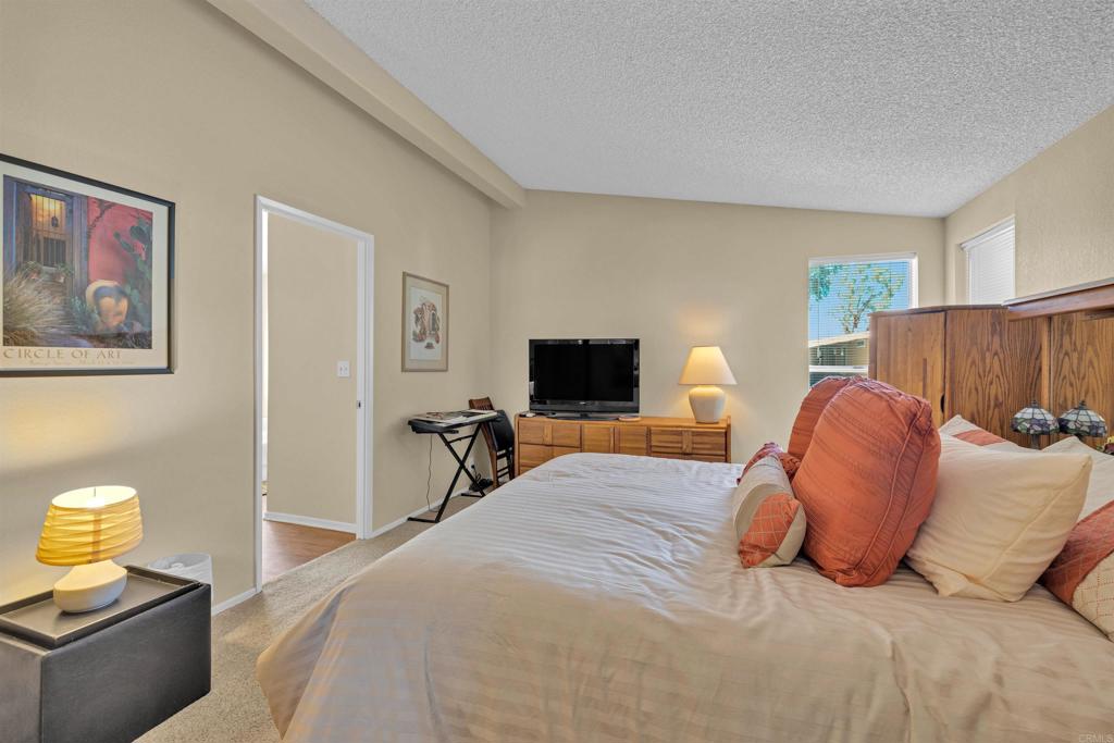 1010 Palm Canyon Drive, Unit 168 Borrego Springs, CA 92004 - Photo 17 of 34 a bedroom with a bed and wooden floor