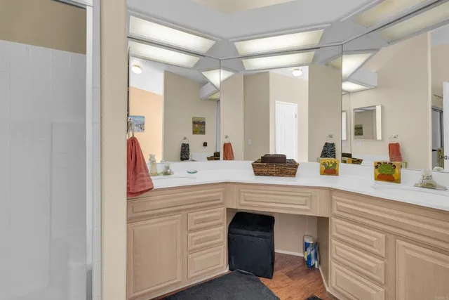 a spacious bathroom with a double vanity sink mirror and