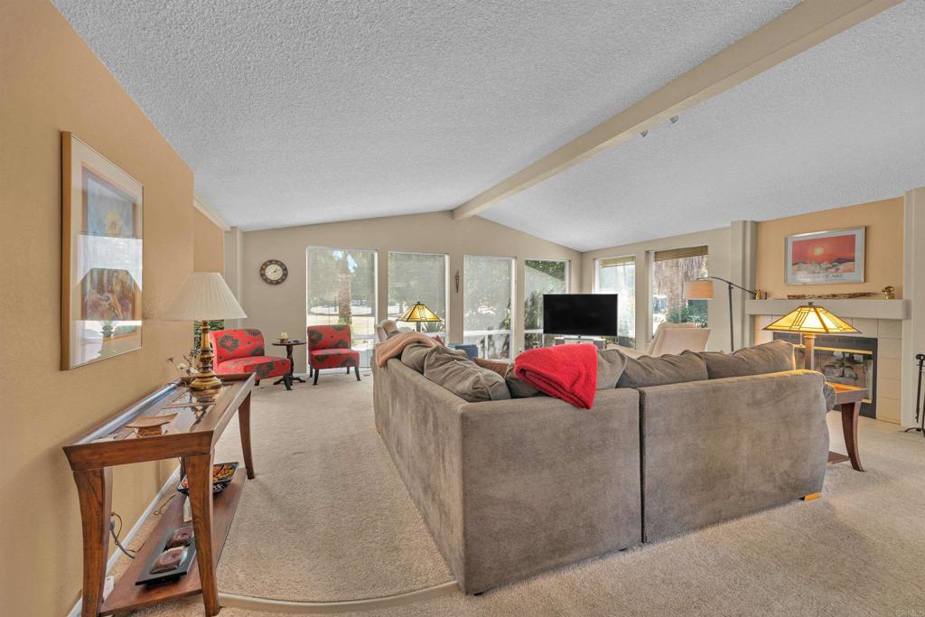 1010 Palm Canyon Drive, Unit 168 Borrego Springs, CA 92004 - Photo 3 of 34 a living room with furniture and a flat screen tv