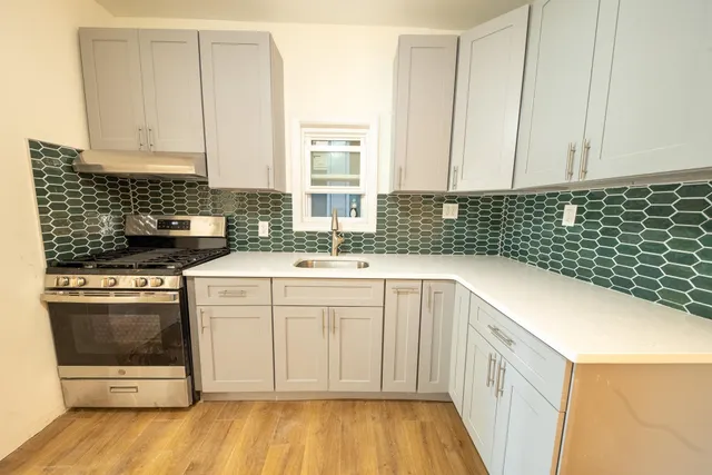 a kitchen with a sink and cabinets