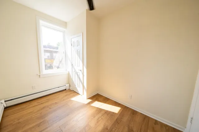a view of an empty room and window