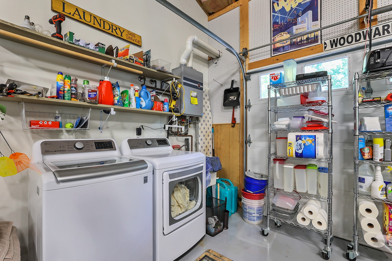 5536 Boy Scout Road Franklin, TN 37064 - Photo 40 of 61 a utility room with fridge dryer and bicycles
