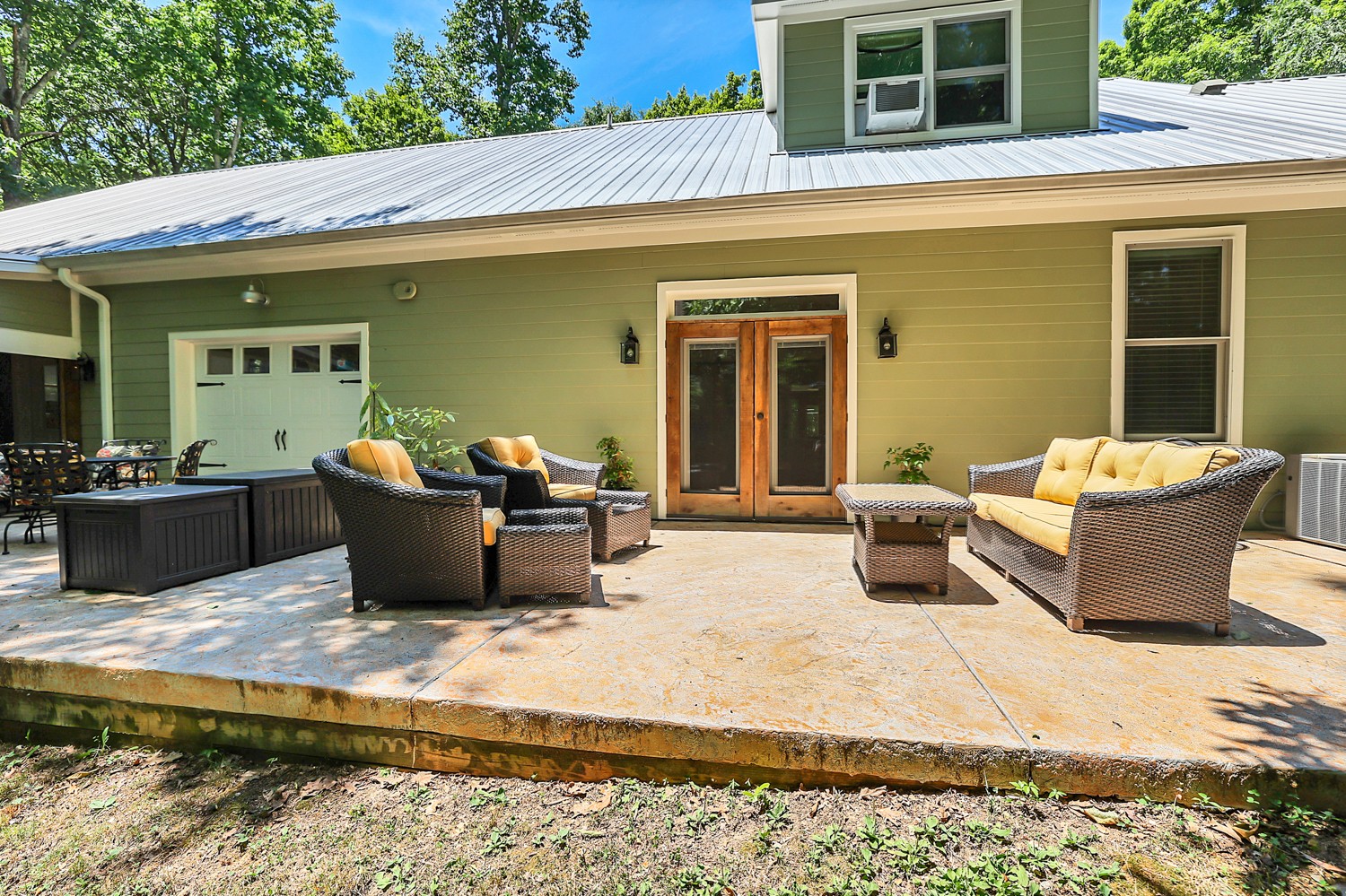 5536 Boy Scout Road Franklin, TN 37064 - Photo 46 of 61 a view of a patio with couches chairs and potted plants
