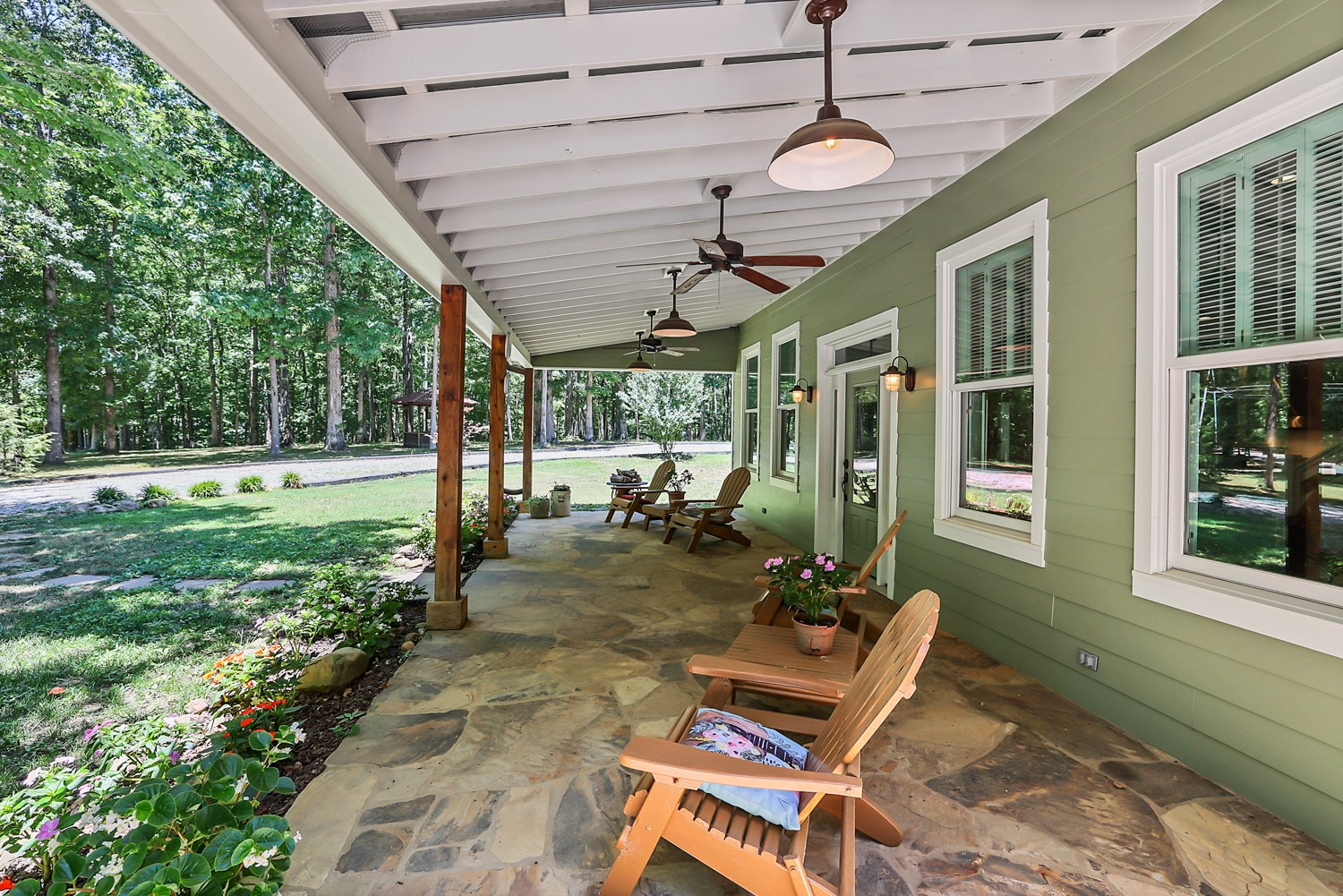 5536 Boy Scout Road Franklin, TN 37064 - Photo 5 of 61 a view of a patio with table and chairs with wooden floor and fence