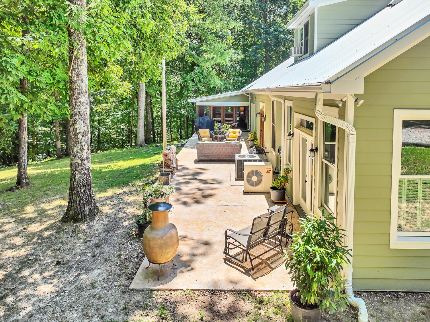 5536 Boy Scout Road Franklin, TN 37064 - Photo 54 of 61 a view of a patio with table and chairs potted plants and large tree