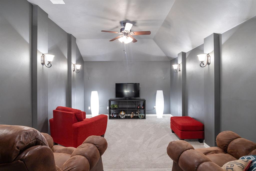 8104 Red Riv Run North Richland Hills, TX 76180 - Photo 30 of 38 a living room with furniture a chandelier and a large mirror