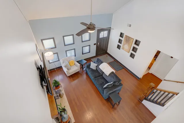 wooden floor with furniture and rug