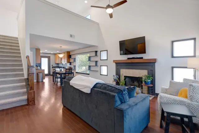 a living room with fireplace furniture and a flat screen tv